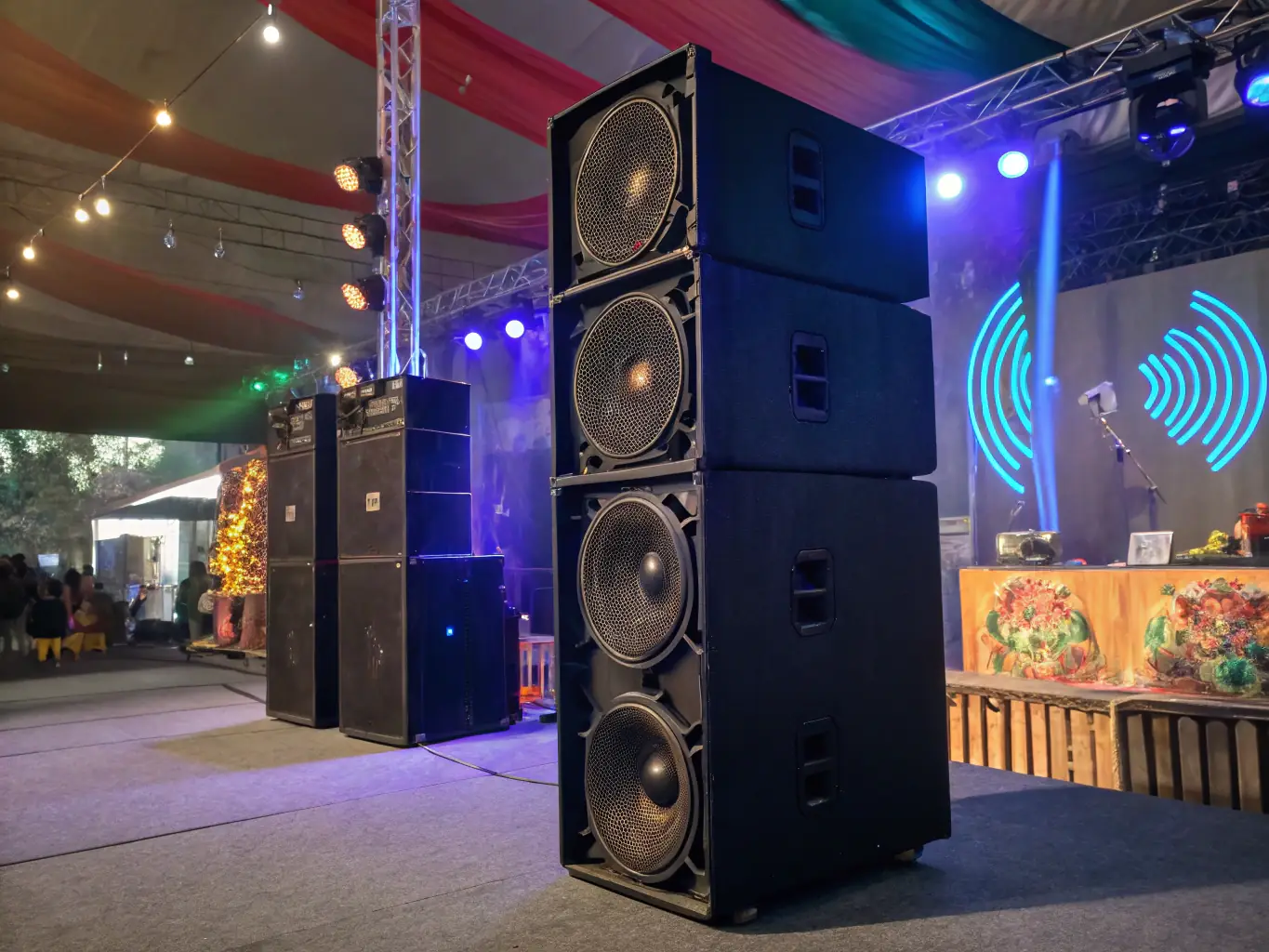 A sleek, modern speaker system set up in a community center, ready to fill the space with music. The scene is vibrant, showcasing people of all ages enjoying the sound.